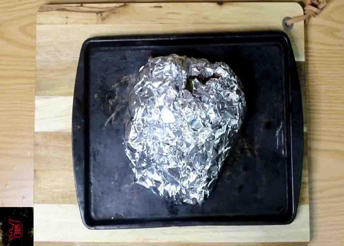 Putting the steak mixture to the prepared foil pack before baking