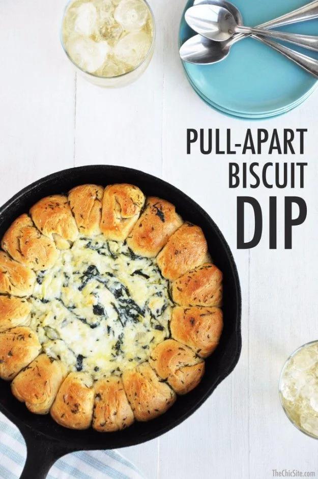 Skillet of hot spinach artichoke cheese dip ringed with golden pull apart canned biscuit pieces recipe worth making twice