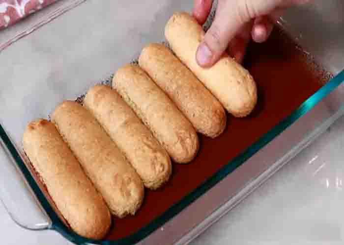Assembling the ladyfingers to make the tiramisu