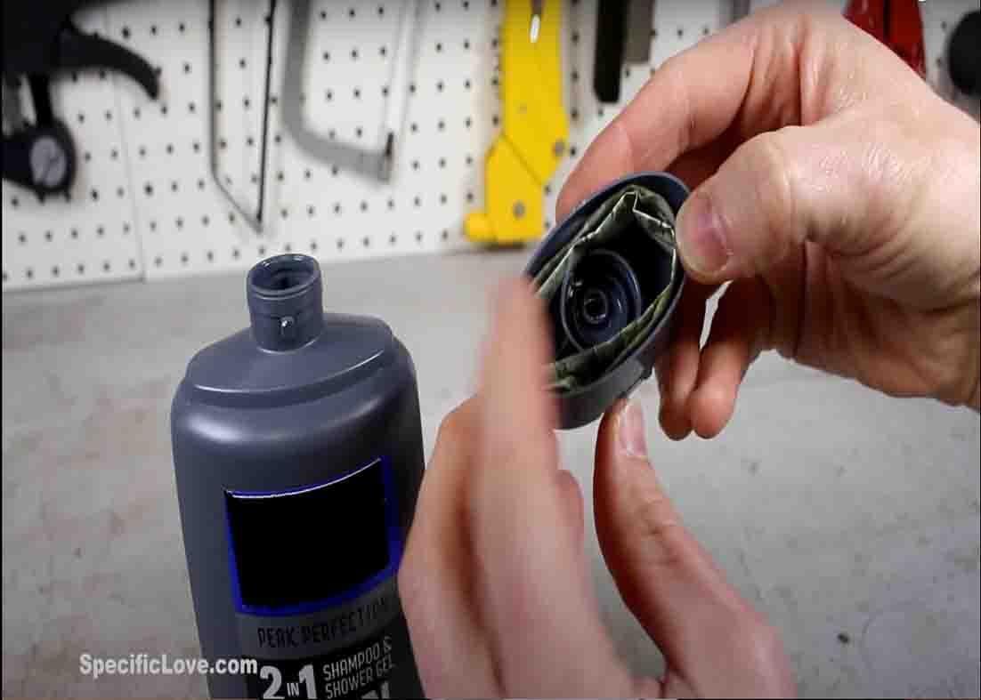 Inserting extra money inside the lid of your shower gel