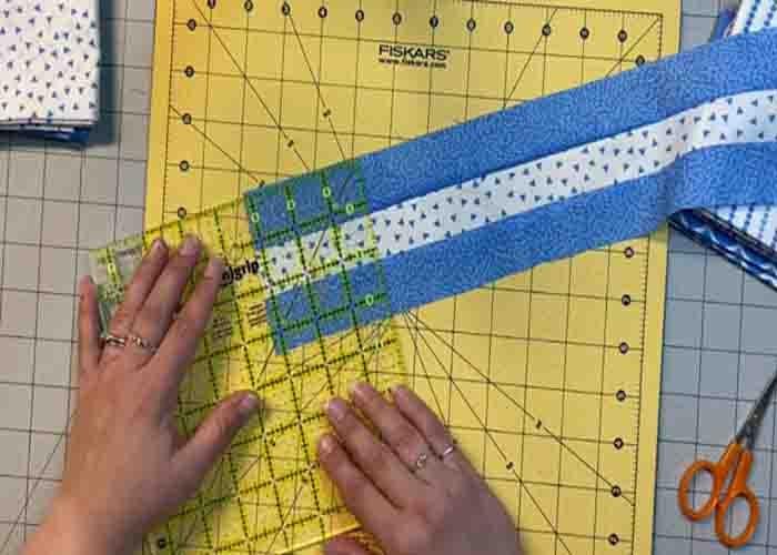 Cutting the strip set to make the beggars quilt block