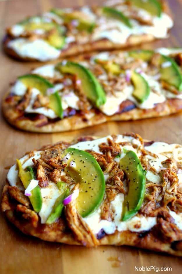 Grilled naan pizza topped with barbecue chicken, fresh mozzarella, sliced avocado and red onion for a quick weeknight meal