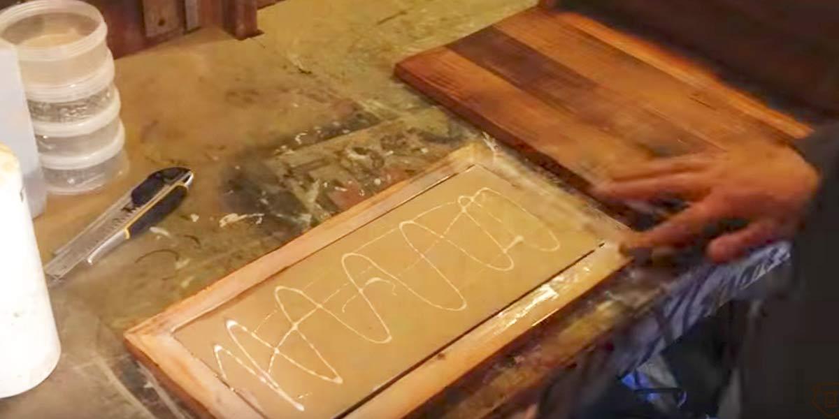 After He Nails And Stains Pallet Wood, Then He Glues An Item To It That You’ll Love!