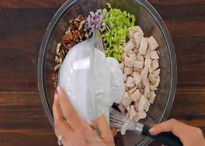 Combining all the ingredients for the chicken salad recipe