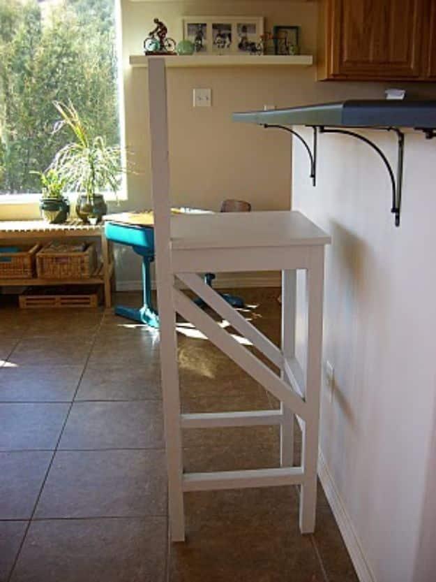 Extra tall bar stool with a white painted 2x2 frame and cross braced sides, standing on tile at a counter height bar