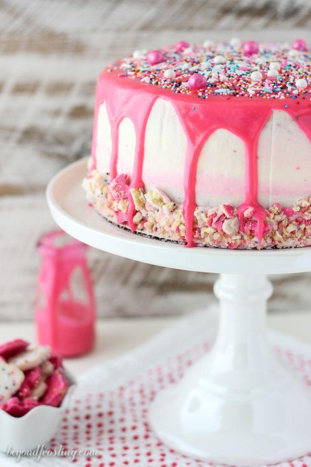 Pink and white layer cake topped with circus animal cookies and nonpareils, a nostalgic birthday cake