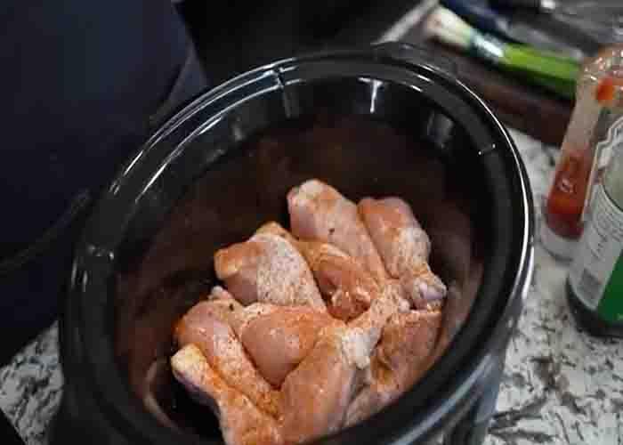 Seasoning the chicken in the slow cooker