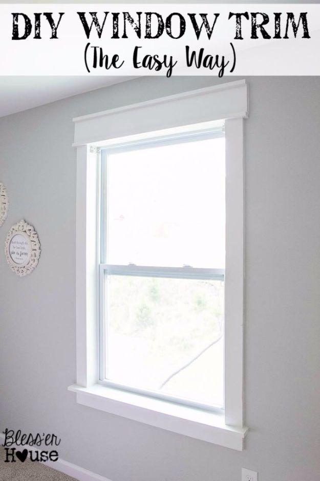 Typeset graphic reading DIY Window Trim The Easy Way over a chunky white trimmed window in a bright bedroom