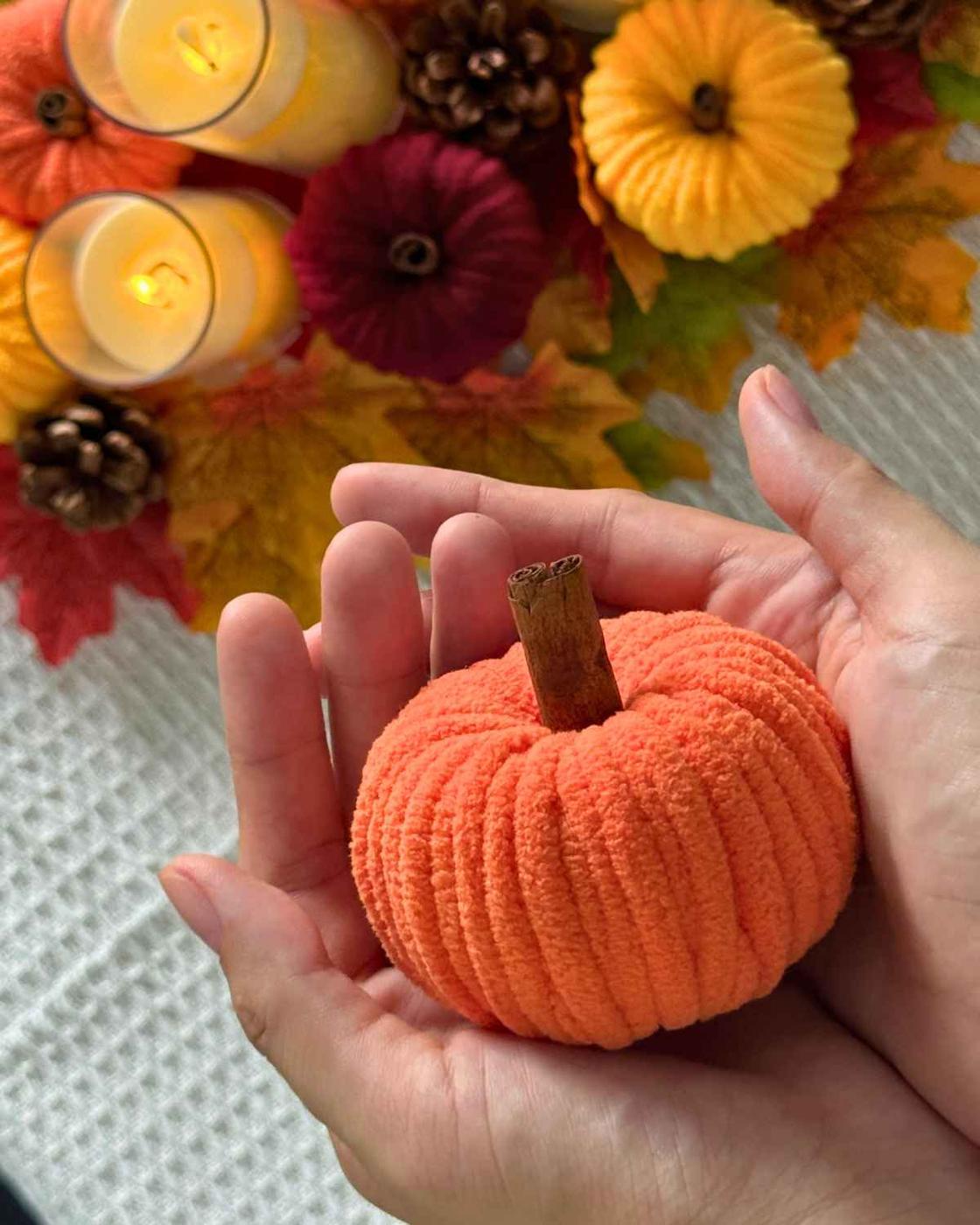 DIY Fall Decor - a group of soft chenille yarn pumpkins on display, an easy idea made from upcycled toilet paper rolls.