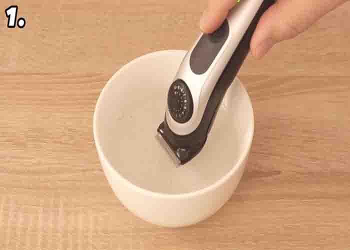Cleaning the razor in a bowl of water