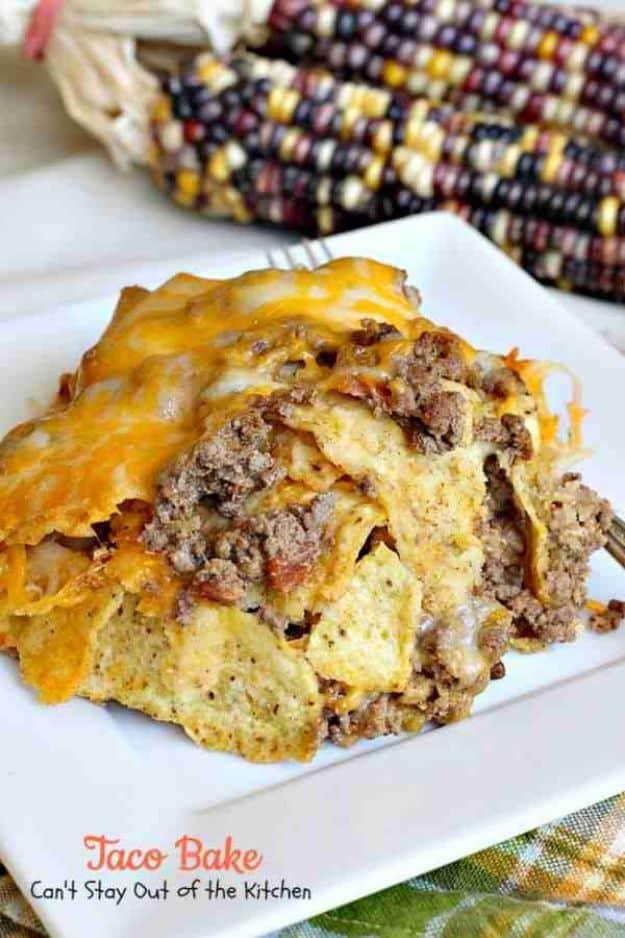 Taco bake casserole layered with tortilla chips, seasoned ground beef and bubbling Colby Jack cheese