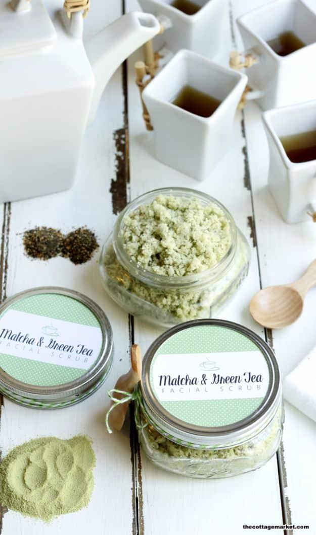 DIY matcha and green tea facial scrub, two labeled jars of green sugar scrub with loose matcha powder and tea leaves