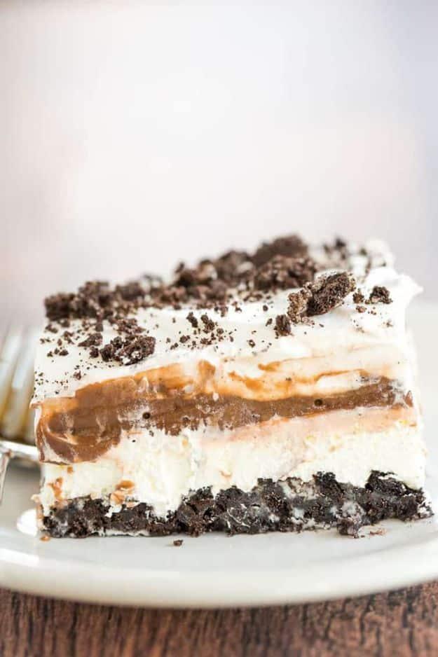 No bake Oreo layer dessert with crushed Oreo crust, cream cheese, chocolate pudding and whipped topping