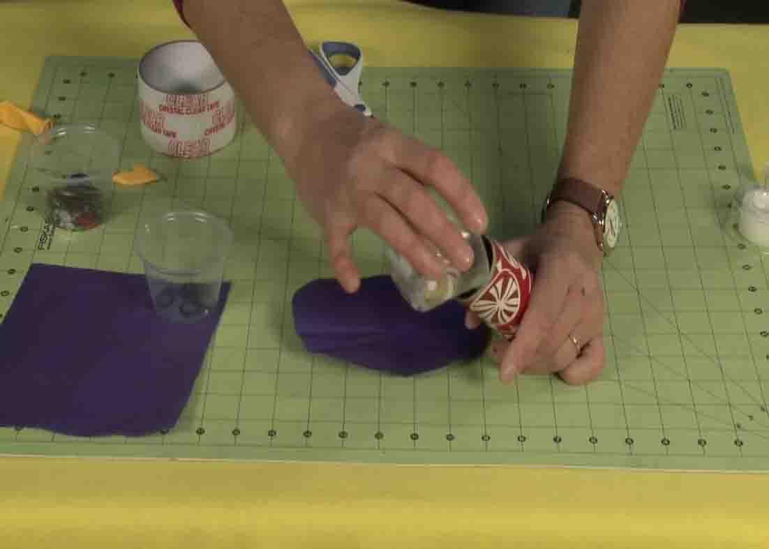 Putting the confetti inside the DIY confetti canon