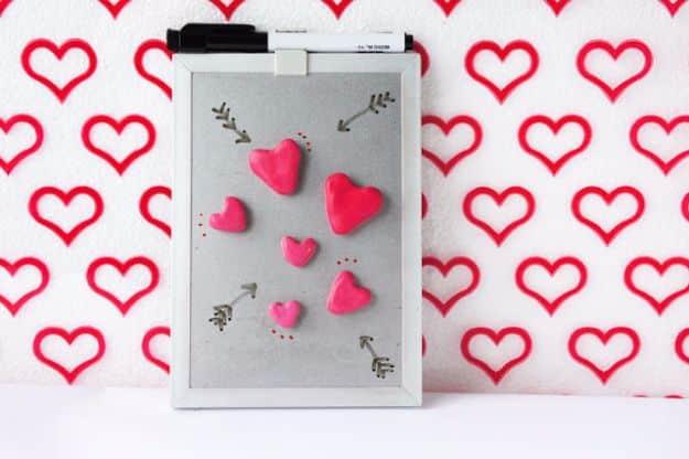 Small three dimensional red and pink clay hearts used as fridge magnets, a cute handmade Valentine gift