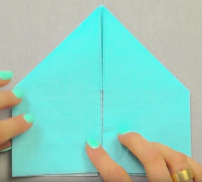 Fold a paper napkin like a bunny