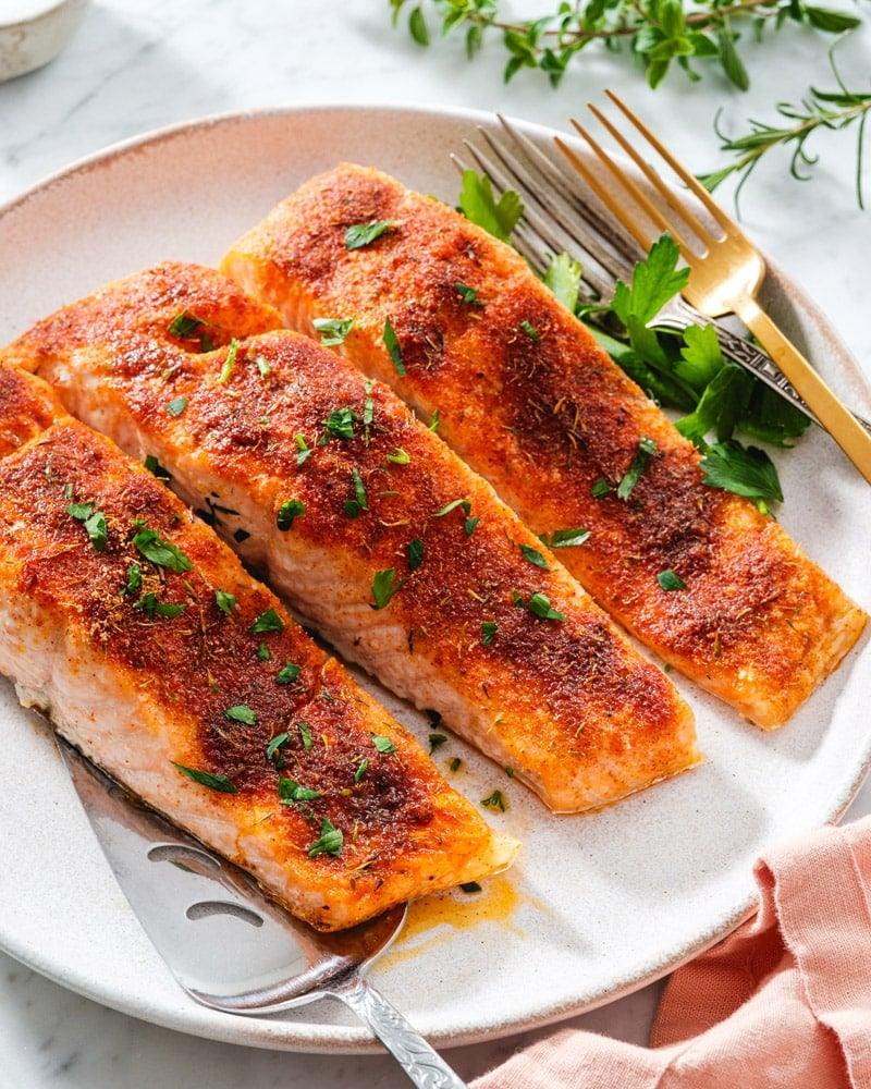 Easy oven baked salmon that comes out tender and flaky every time with no flipping required for the whole family