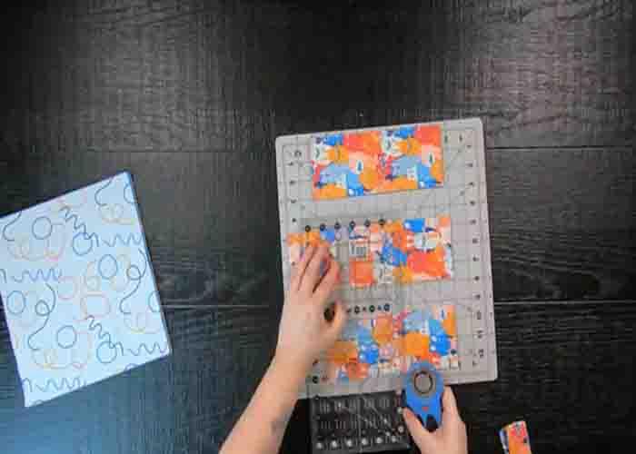 Cutting the layer cake to make the tower block quilt