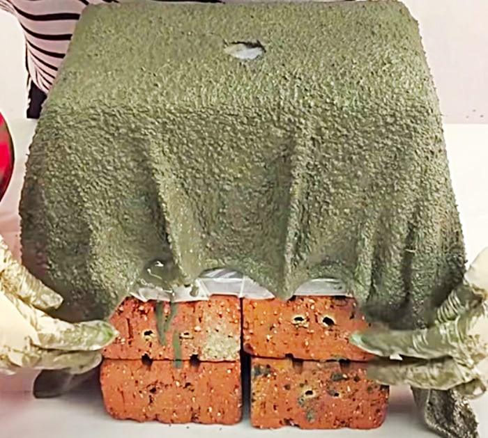 Soak towels in cement to make a planter