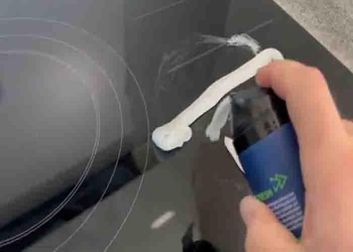 Applying shaving cream to the glass stove