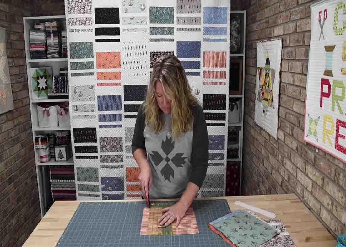 Cutting the layer cakes to make the stack em up quilt blocks