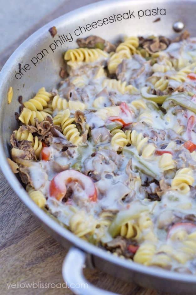 One pan philly cheesesteak pasta for two with thin sliced roast beef, peppers, onions and melted cheese