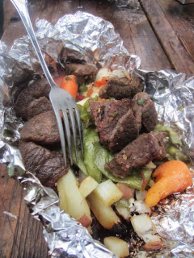 Skewered campfire kabobs grilled over the fire for a fun hands on camping dinner the whole group can build