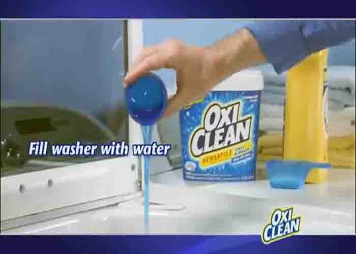 Filling the washer with water, then adding a cup of OxiClean to prevent clothes from fading