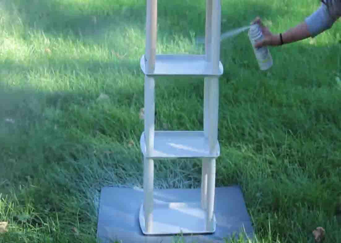 Spray painting the DIY bookshelf