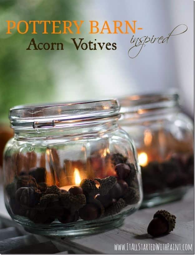 Pin graphic reading Pottery Barn inspired Acorn Votives showing jars filled with acorns around lit tea lights