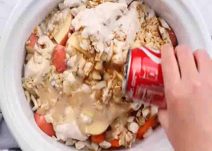 Adding the coca cola in the slow cooker