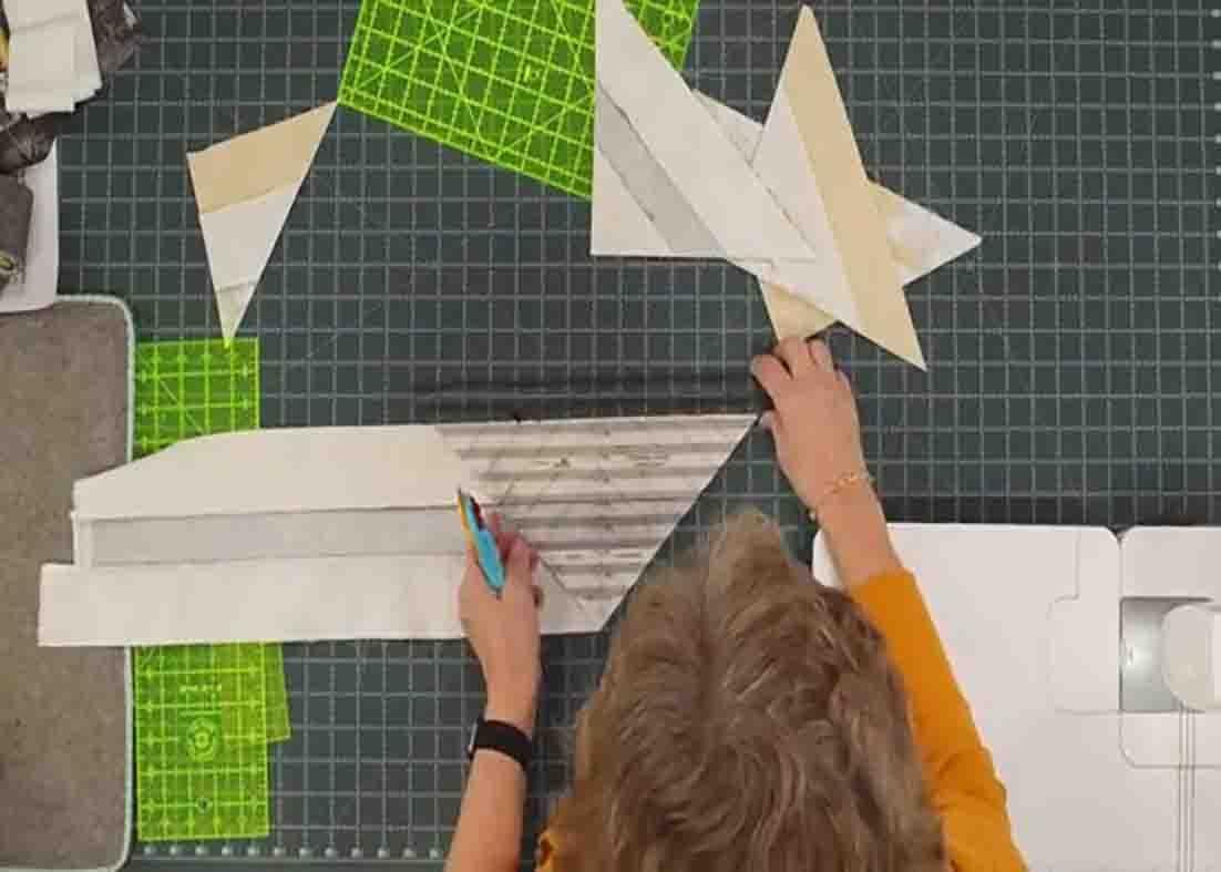 Cutting the fabric to make the summer in the park blocks