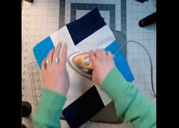 Pressing the completed two by two quilt block
