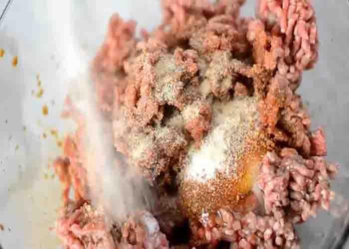 Seasoning the ground beef for the hamburger steak recipe