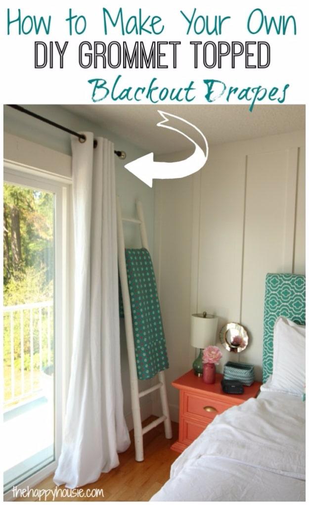Full length white linen curtain panels with matte gold grommets at the top, hanging beside a bright bedroom doorway