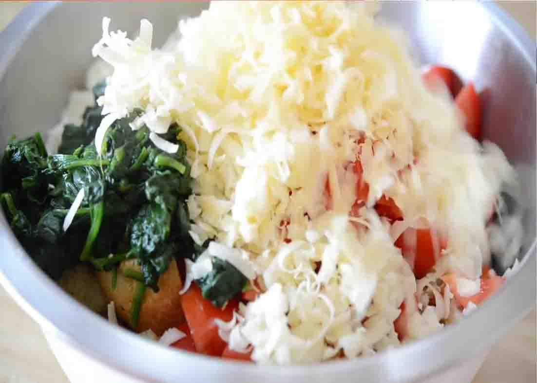 Combining all the make-ahead breakfast casserole ingredients in a bowl