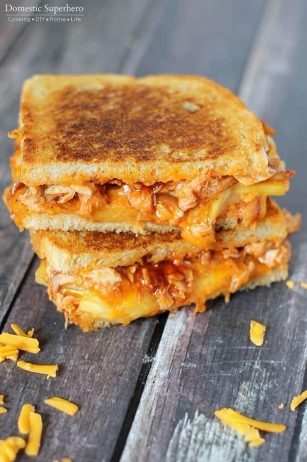BBQ chicken and pineapple grilled cheese cut in half showing melted cheddar and pineapple slices for a quick weeknight meal