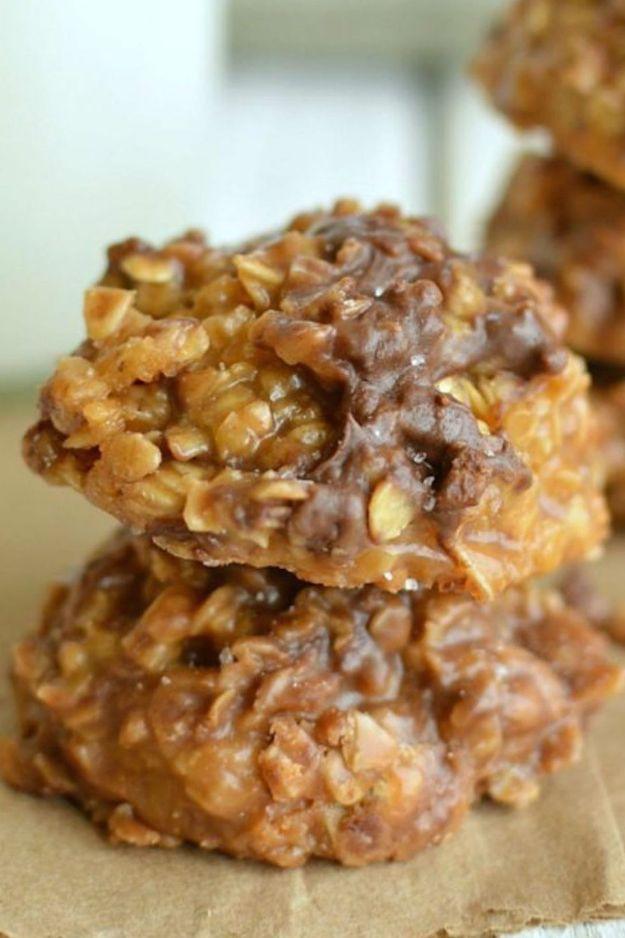 No bake caramel cookies, golden oat cookies studded with chocolate and toffee chips stacked on parchment