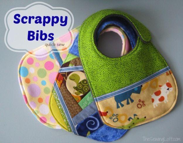 Quilting scraps baby bibs, one green and one pieced from blue yellow and novelty print patchwork, on a white background