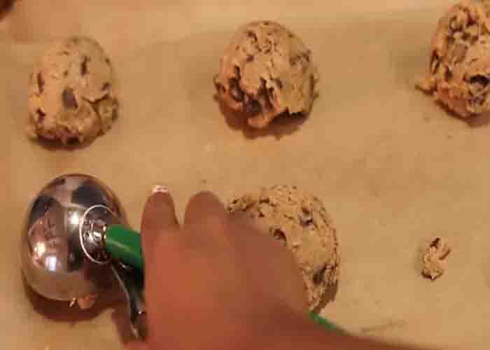 Adding the brown butter chocolate chip cookies on the baking tray