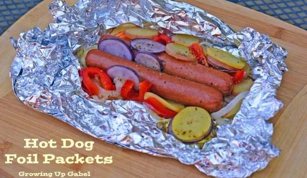 Hot dogs and toppings sealed into a foil packet and grilled together for a simple no fuss camping dinner