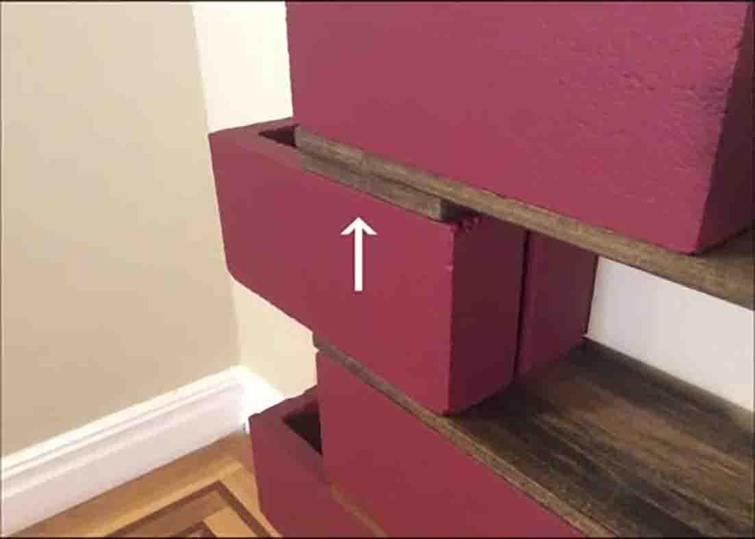 Assembling the cinder block bookshelf