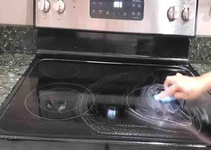 Wiping the Dawn dish soap off the glass stovetop