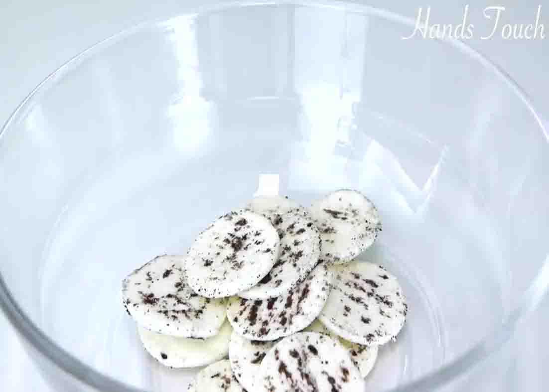 Separating the cream filling from the Oreo cookies