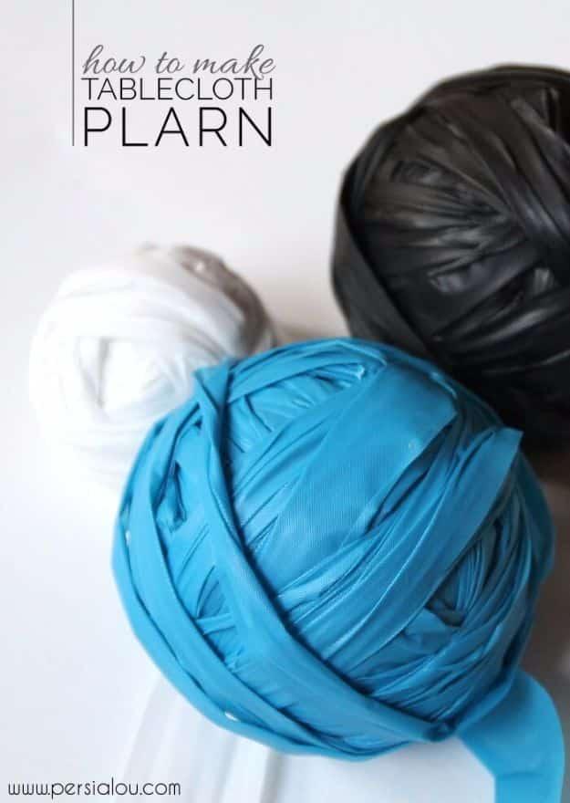 Plastic bag craft: three balls of tablecloth plarn in teal, black and white, on a how to make plarn title graphic