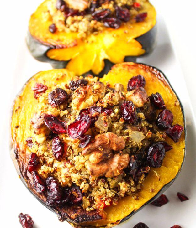 Roasted acorn squash halves filled with quinoa stuffing, dried cranberries, chopped walnuts and herbs