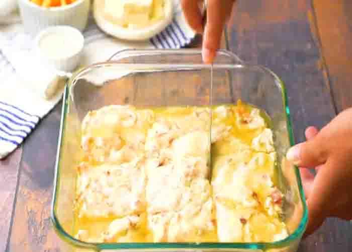 Cutting the cheddar bacon swim biscuits into squares