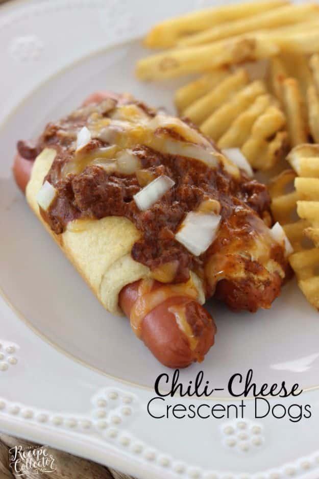 Chili cheese crescent dogs baked in a square dish, topped with hot dog chili, melted cheese and onions