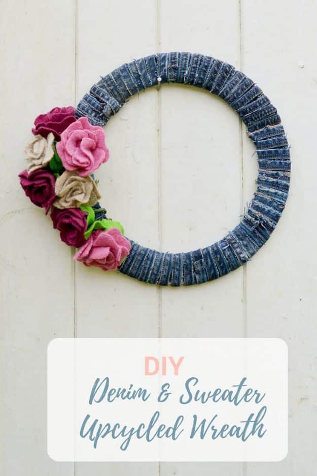 Denim wreath with felt roses in plum, pink and cream on a jeans seam wrapped wire frame on white boards