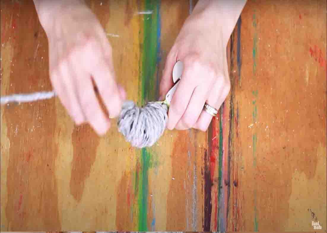 Making poms using the pom pom maker
